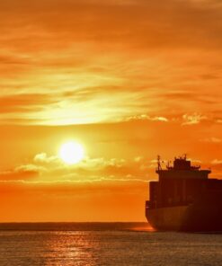 Fototapeta Kontejnerová loď při západu slunce