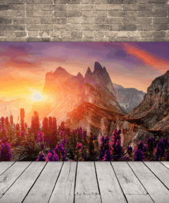 Obraz slunce vykukujícího zpoza hor